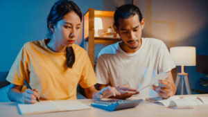 stress-asian-couple-man-woman-use-calculator-calculate-family-budget
