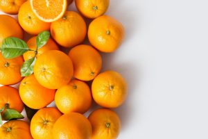 bright-juicy-ripe-orange-fruits-with-leaves (1)