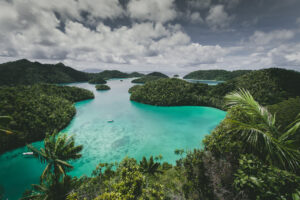 landscape-wajag-island-surrounded-by-sea-cloudy-sky-indonesia