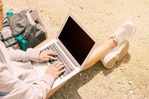 woman-sitting-ground-working-laptop